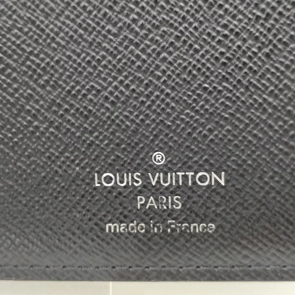 Louis Vuttton Damier Graphite wallet.